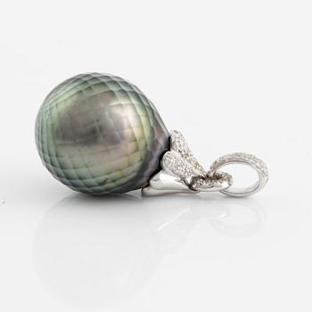 Carved cultured Tahiti pearl and brilliant cut diamond pendant.