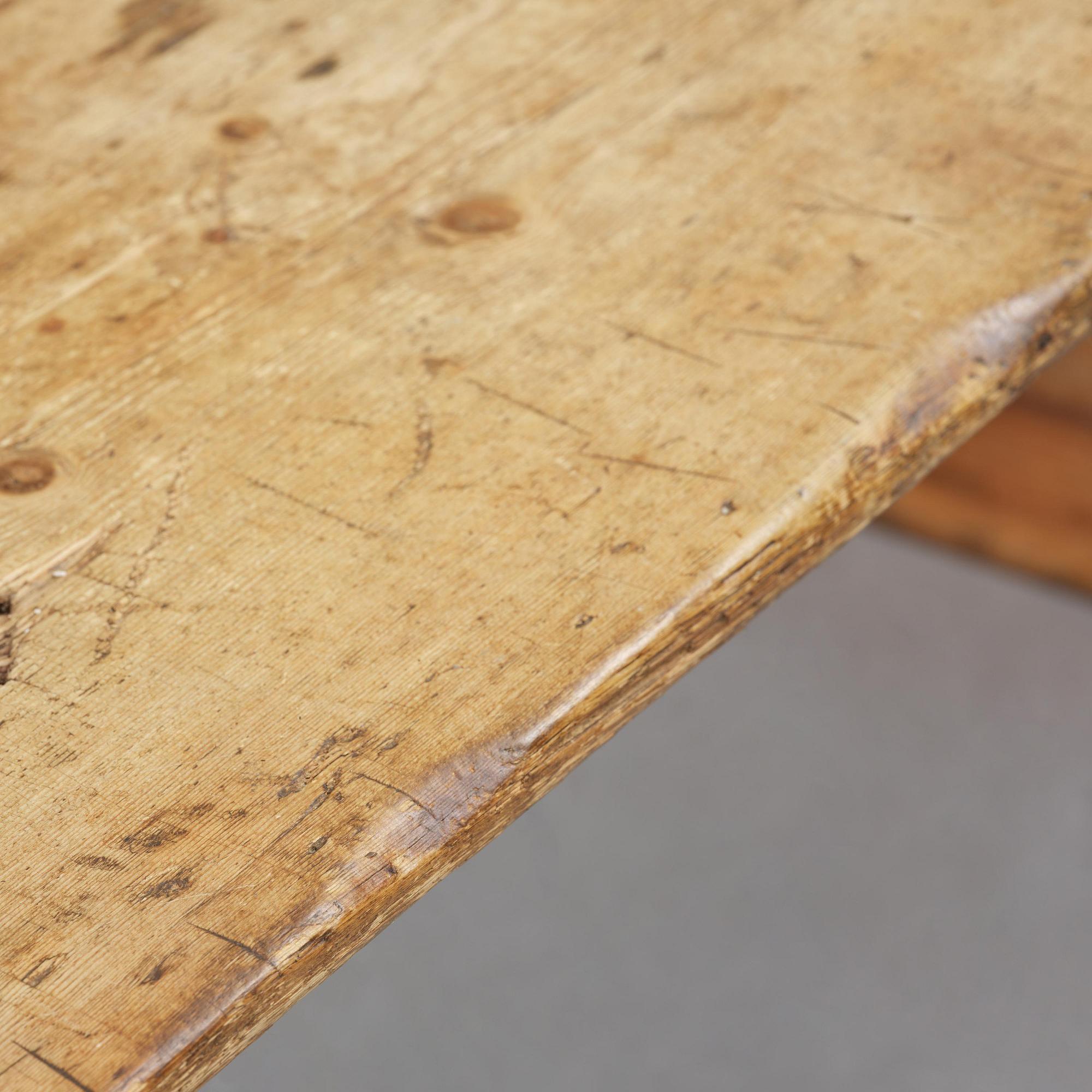 A pine trestle table, 20th century incorporating older elements.