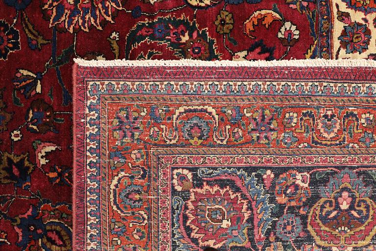 A semi-antique Meshad carpet, signed 'Saber', approx. 459 x 348 cm.