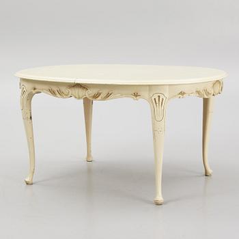 A Rococo style Dining Table with Chairs, first half of the 20th Century.