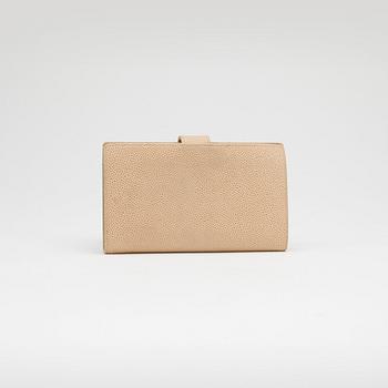 CHANEL, a beige caviar leather wallet.