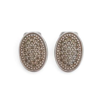 BURBERRY, a pair of silver colored clip earrings.