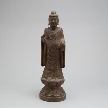 A stone sculpture of buddha,  South East Asia, 20th Century.