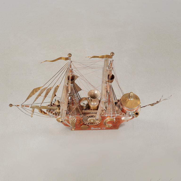 A boat sculpture, dated -75.