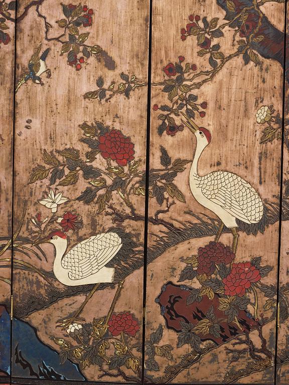 A six leaf coromandel lacquer screen, Qing dynasty (1644-1912).