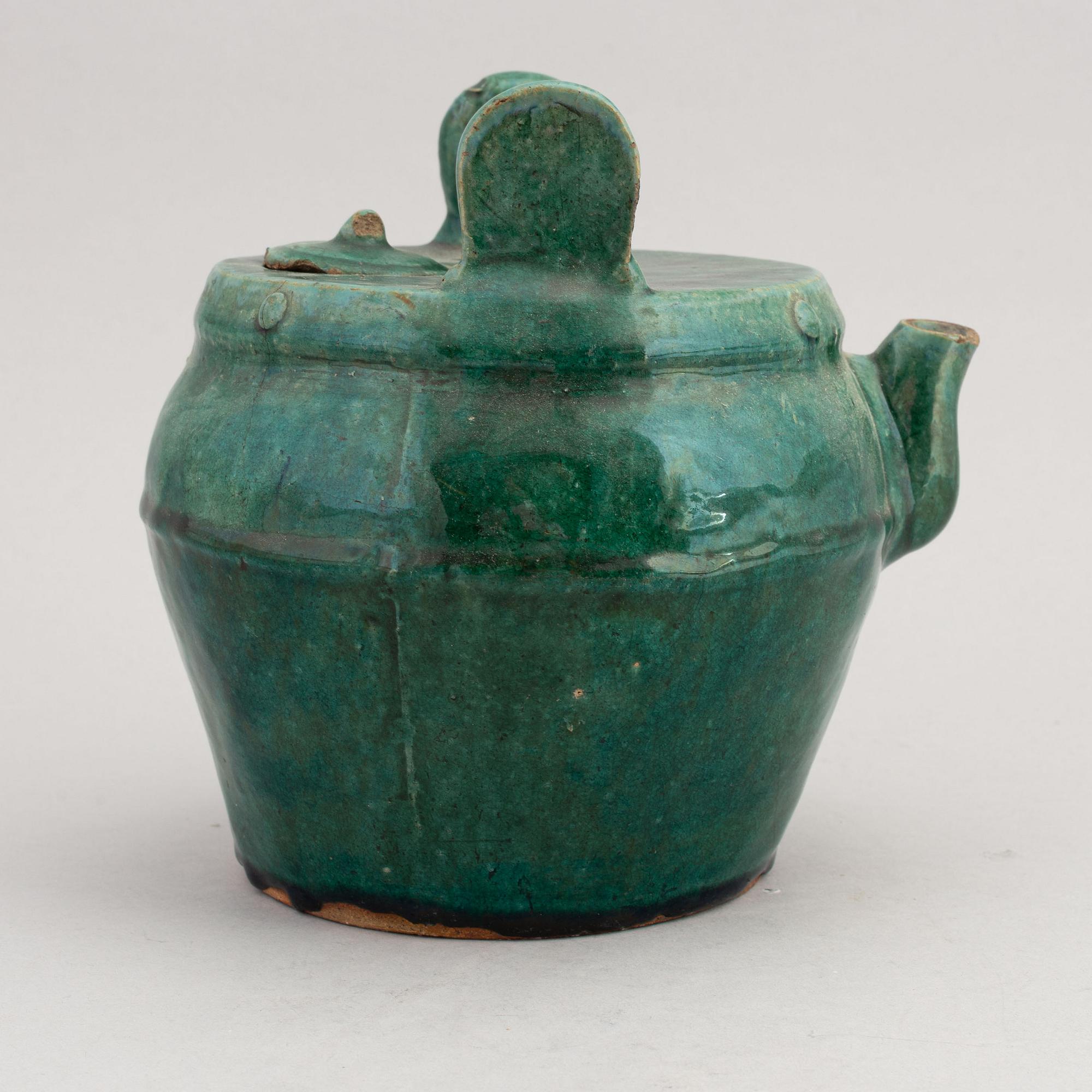 A Chinese green glazed 'Shiwan' ceramic teapot in the shape of a water bucket, 19th Century.