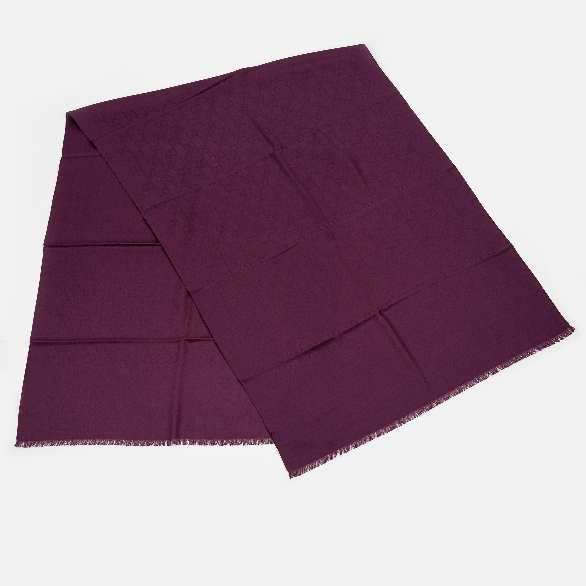 Gucci, a wool and silk mix "GG" jaquard shawl.