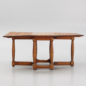 A drop-leaf table, 18th Century.