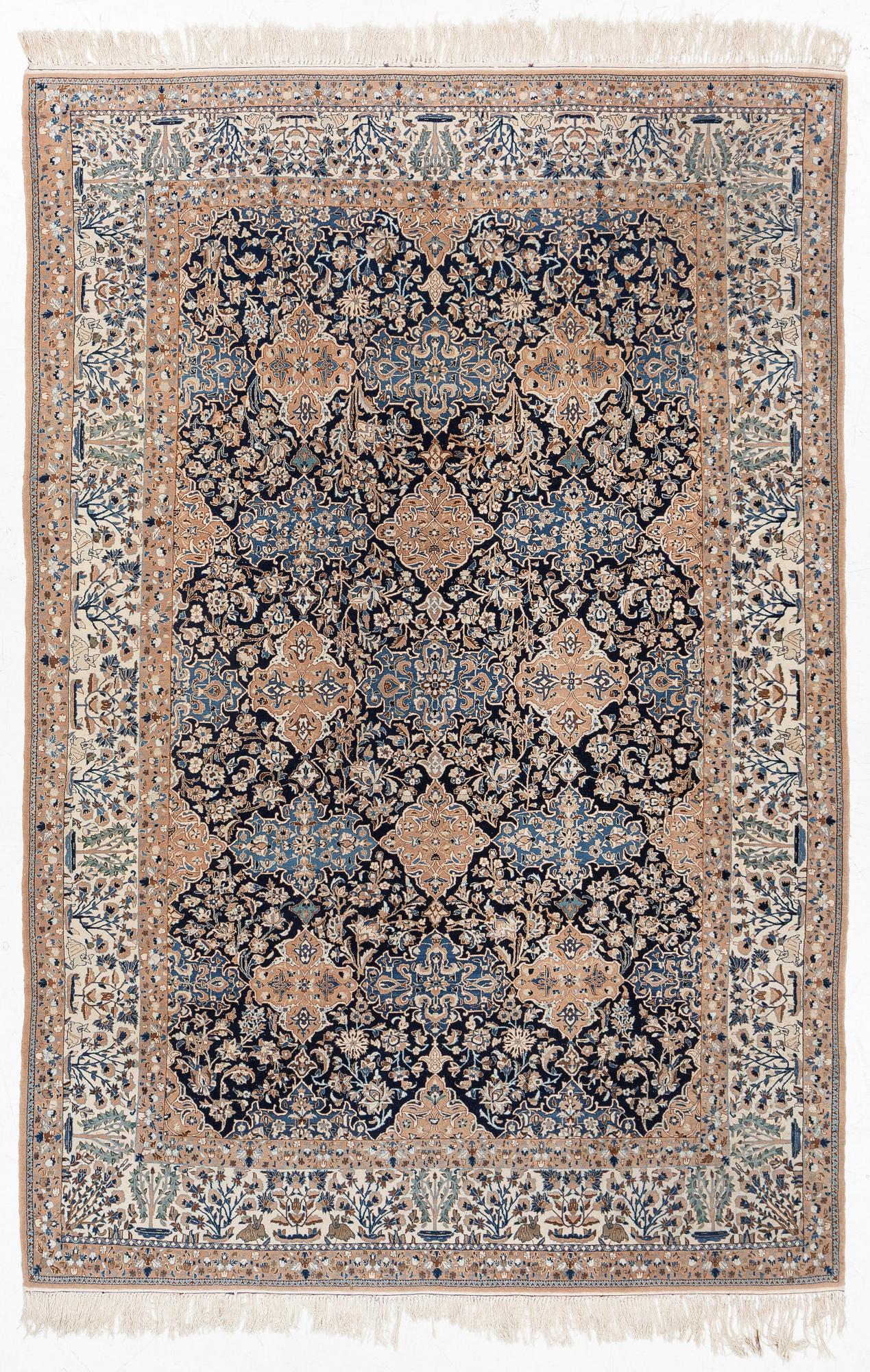 A semi-antique Nain carpet, part-silk, c. 261 x 175 cm.
