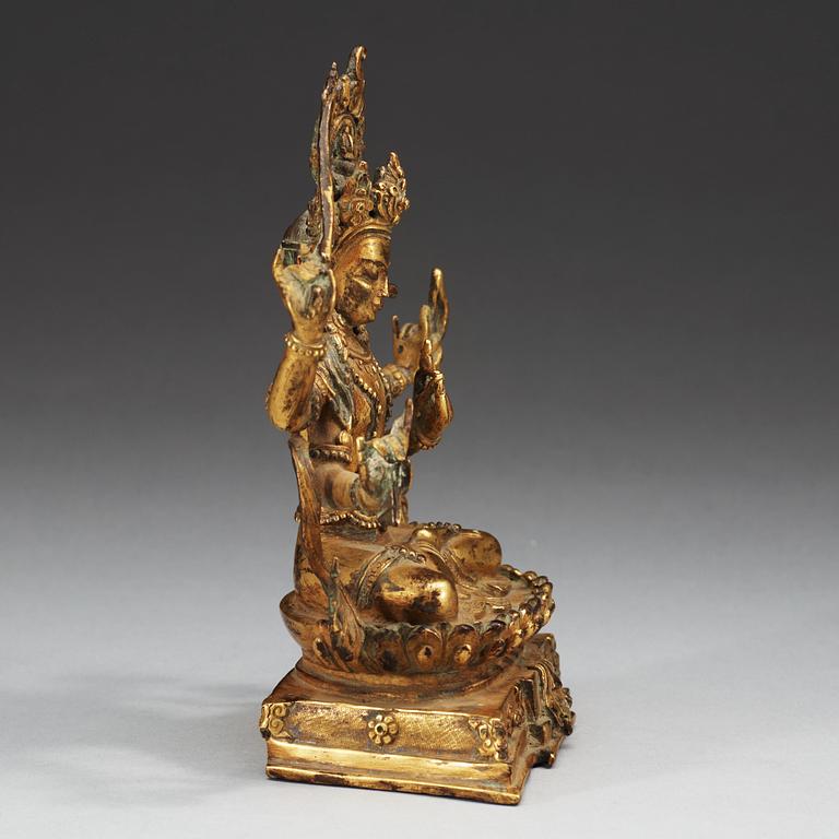 A Tibetan gilt bronze figure of a seated Bodhisattva, Qing dynasty, 18/19th Century.