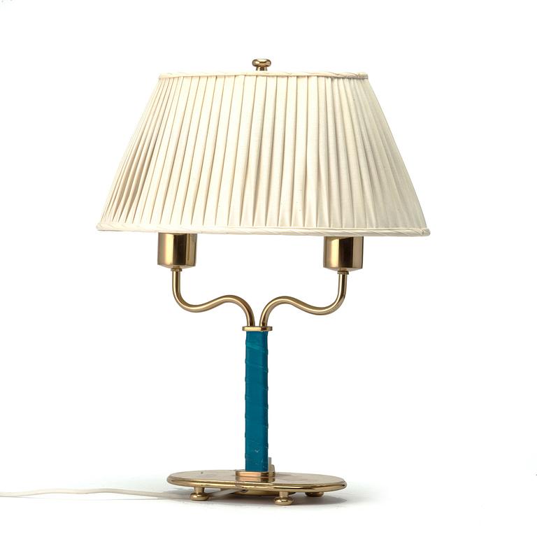 Josef Frank, a brass and blue leather table lamp, Svenskt Tenn, Sweden, model 2388.