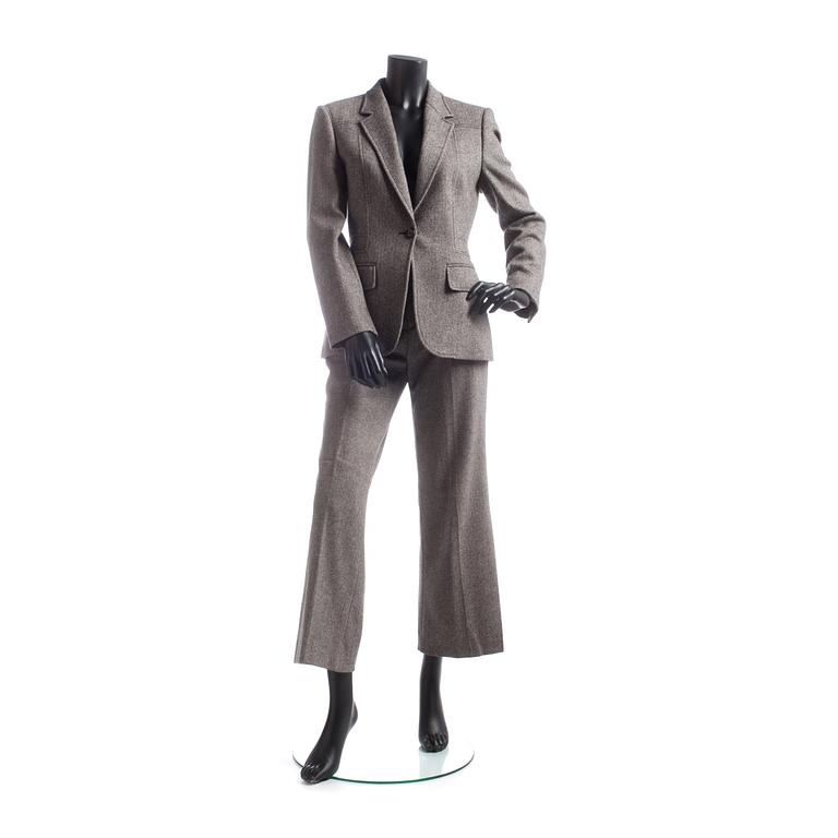 GUCCI, a two-piece suit consisting of jacket and pants.