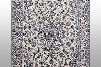 A Nain carpet, part silk, 6 laa, c. 250 x 160 cm.