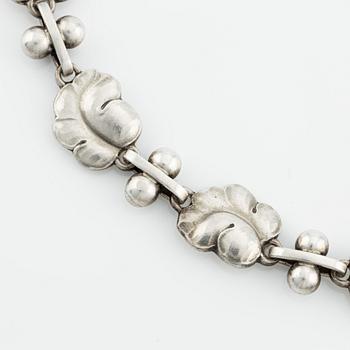 Harald Nielsen, a sterling silver necklace, a brooch, and a pair of earrings, for Georg Jensen, Denmark post 1945.