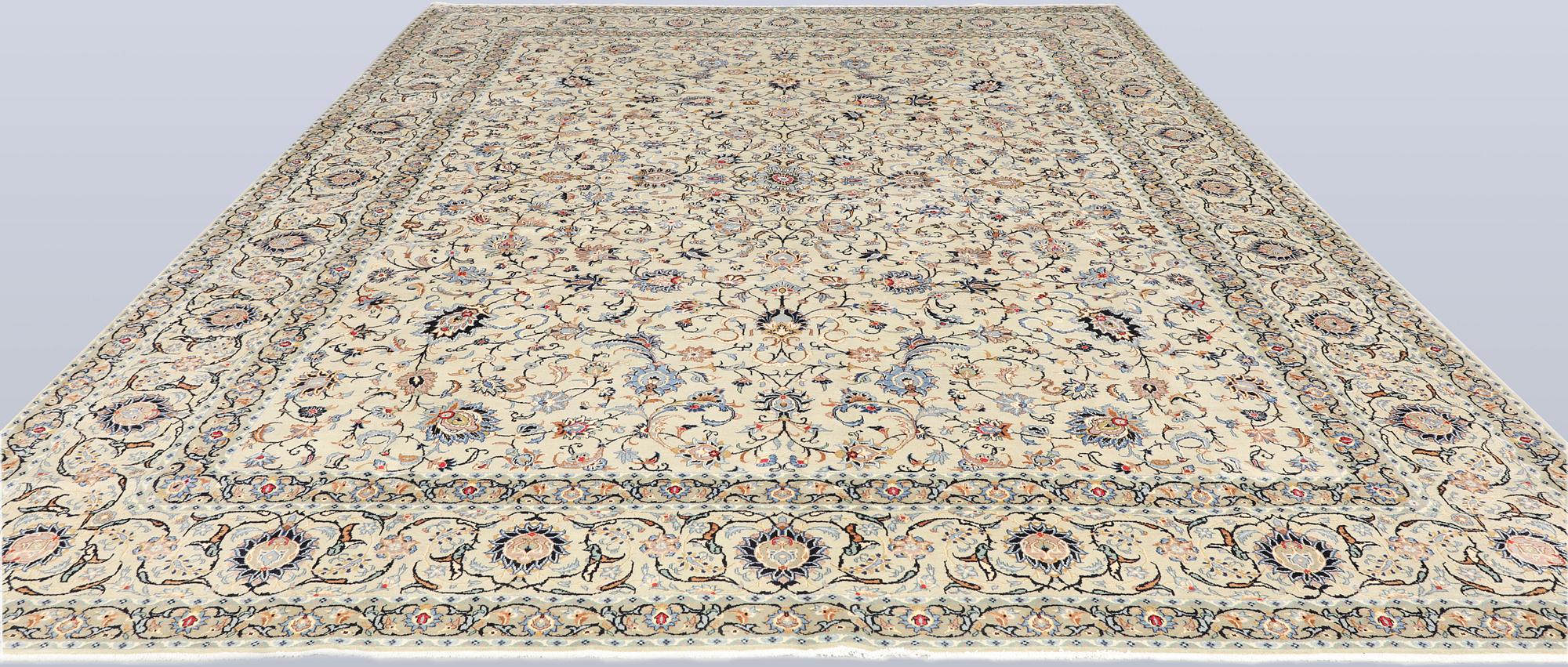 A Keshan carpet, signed, approx. 410 x 323 cm.