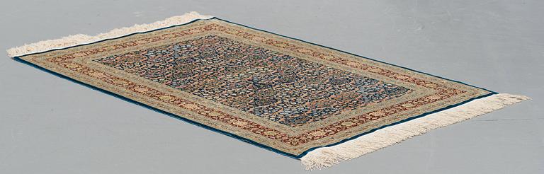 A RUG, old silk Hereke, ca 143,5 x 102,5 cm (+ the ends have 1,5 cm flat weave on each side).