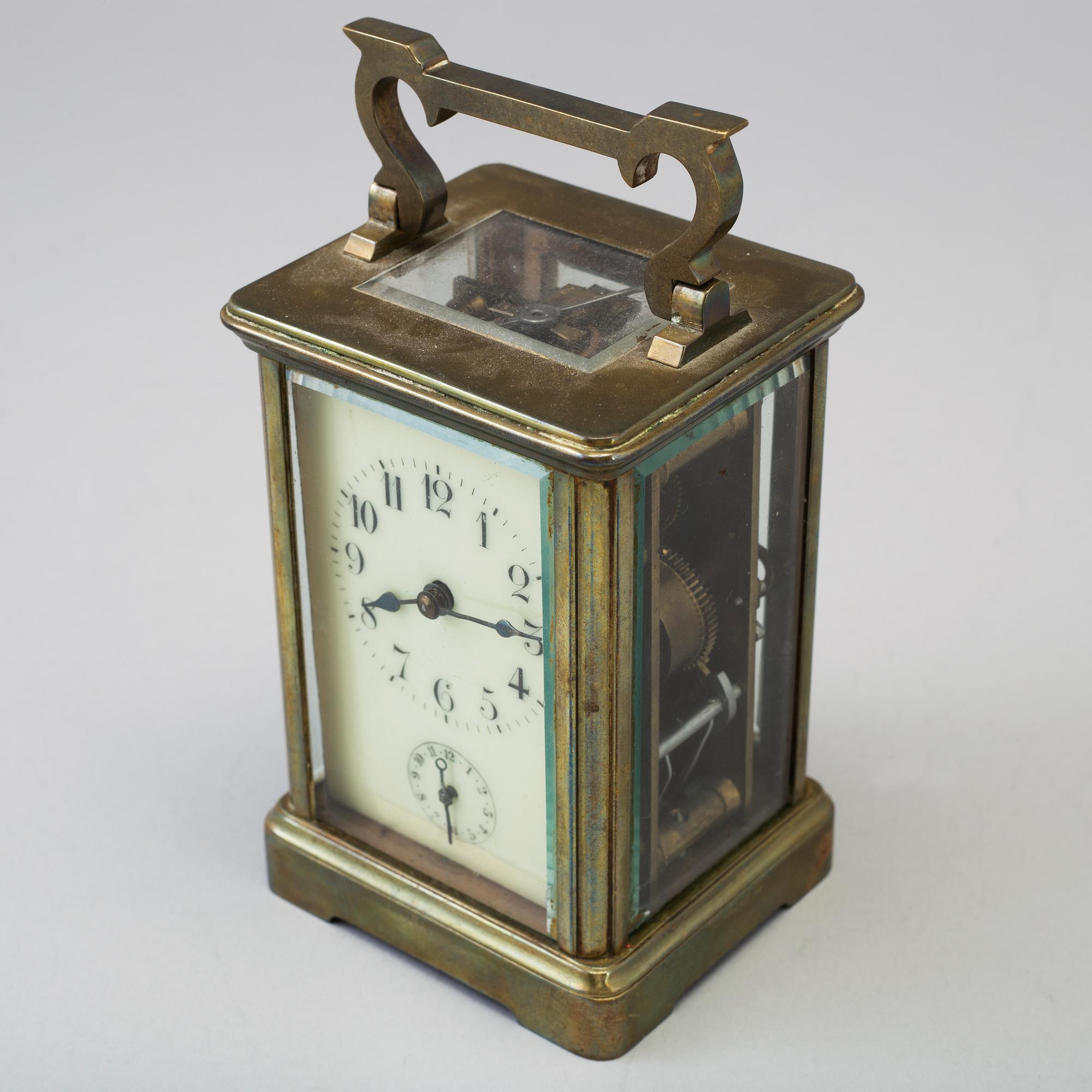 An early 20th century brass and glass carriage clock.