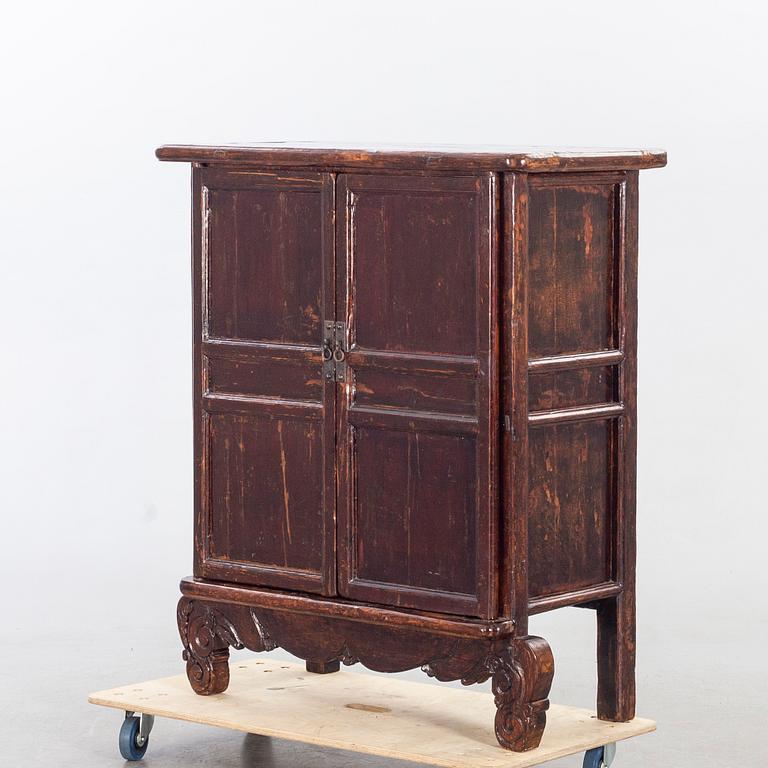 A 19TH CENTURY CHINESE CUPBOARD.