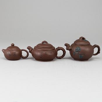 A group of three yixing pots, 20th century.