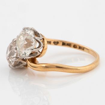 An 18K gold ring set with two old-cut diamonds with a total weight of ca 3.10 cts quality ca J/K si.