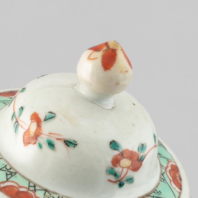 A pair of famille rose vases with covers, Qing dynasty, Qianlong (1736-95).