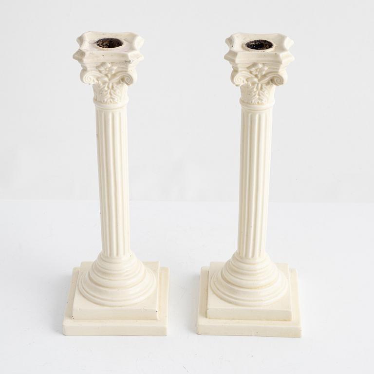 A pair of creamware candlesticks, around 1900.