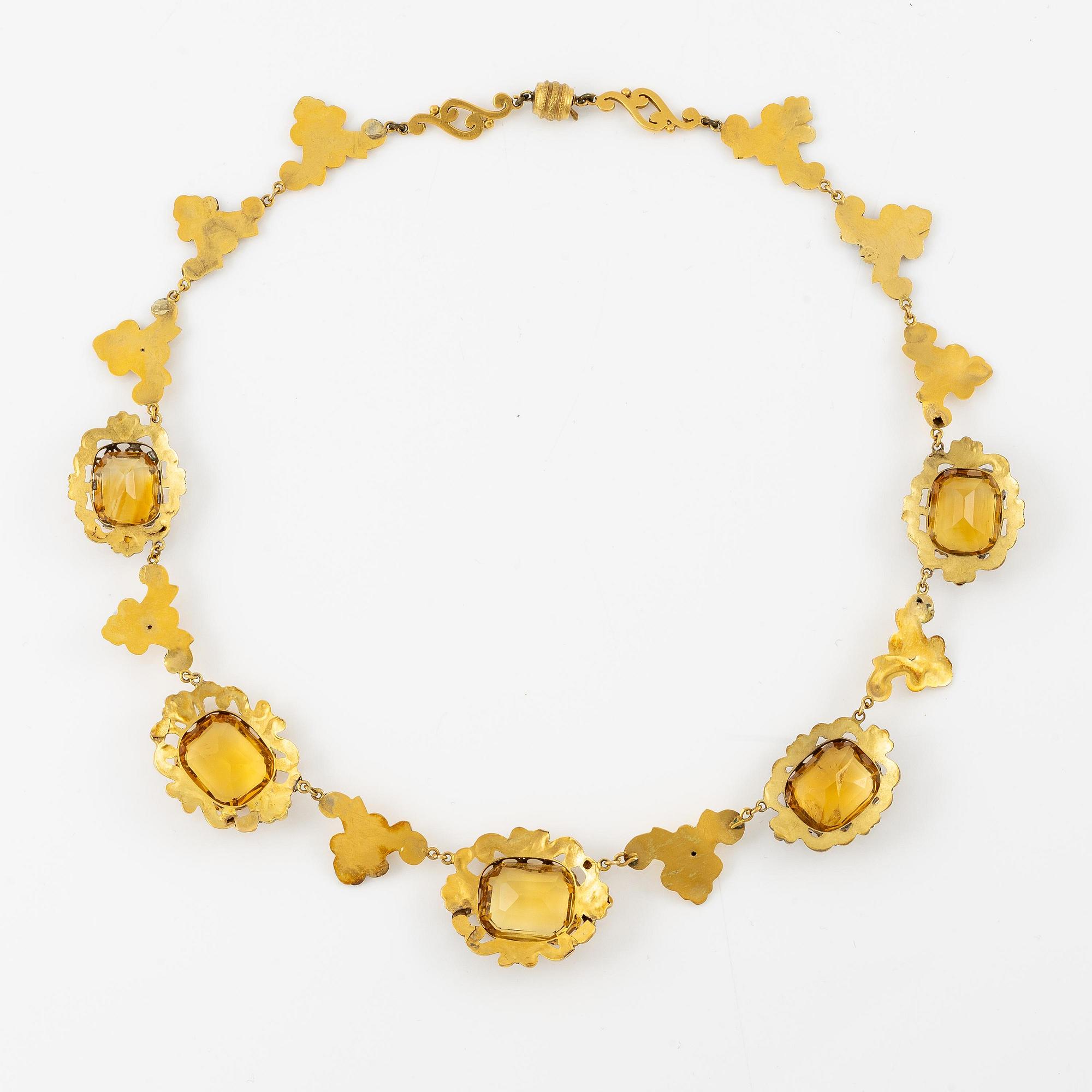 A necklace and a pair of earrings in 14K gold with faceted citrines.