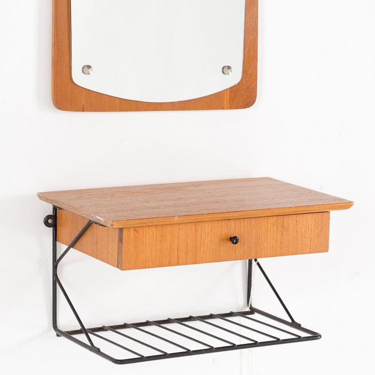 A mirror and shelf, 20th century.