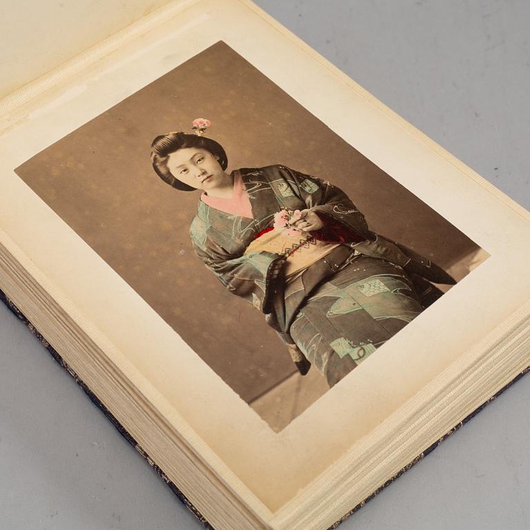 Two signed photographs of the Japanese crown prince and his wife and a photo album.