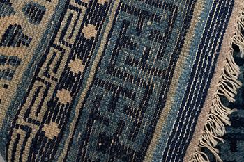 A semiantique Baotou carpet, measurment 130x64 cm.