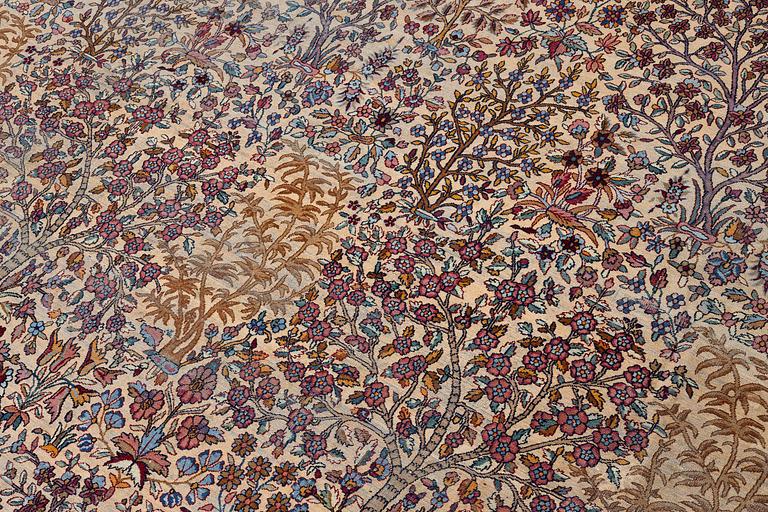An antique 'Millefleur' Kerman Laver carpet, c. 964 x 426 cm.