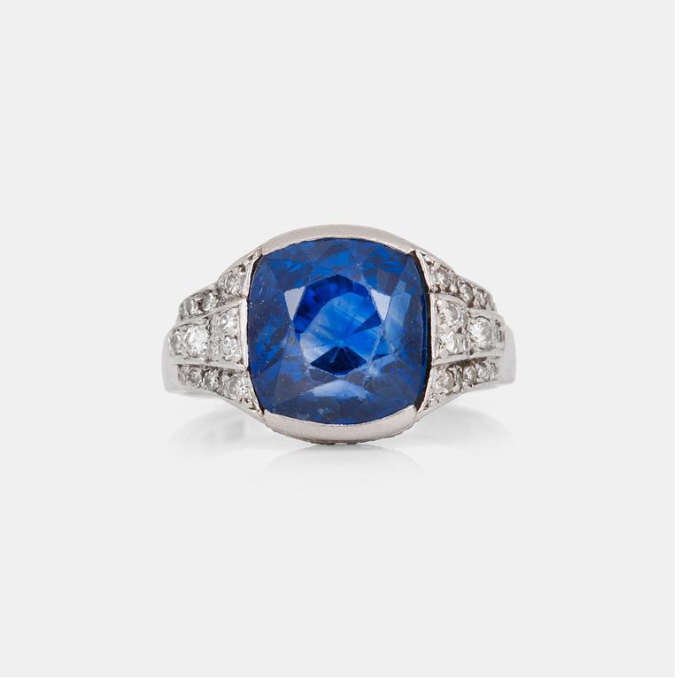 A circa 11.00 ct sapphire and single-cut diamond ring. Total carat weight of diamonds circa 0.40 ct.