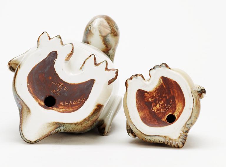 Two Gunnar Nylund stoneware figures depicting a penguin mother with child, Rörstrand.