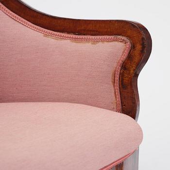A pair of Baltic mahogany fauteuils, mid 19th century.