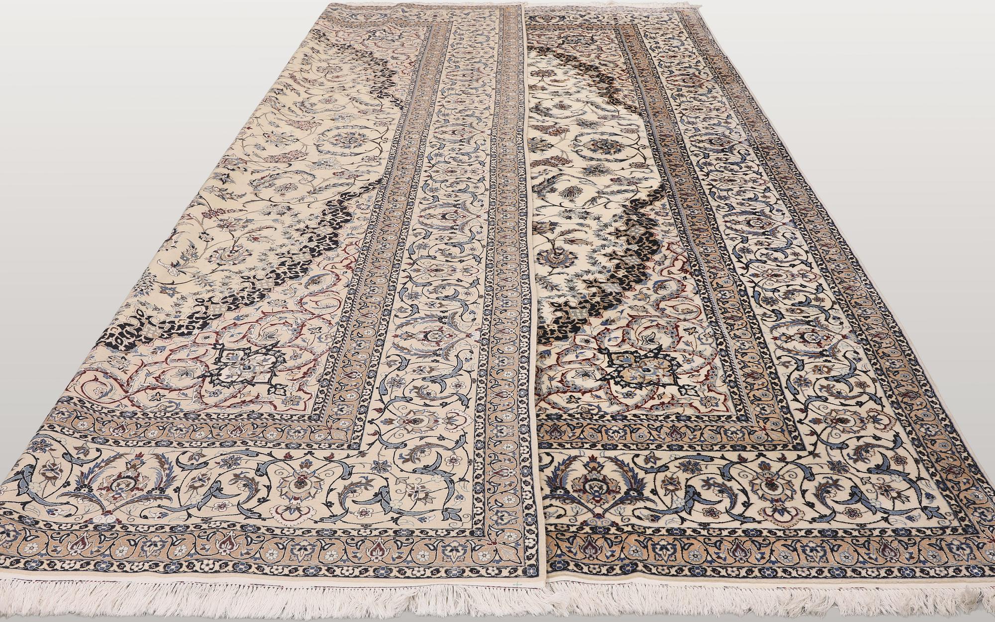 A Nain part silk carpet, 407 x 304 cm.