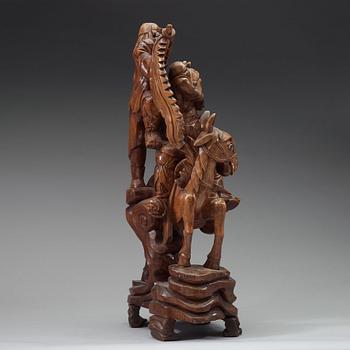 A large wooden sculpture group of Guandi on horseback and an attendant, Qing dynasty (1644-1912).