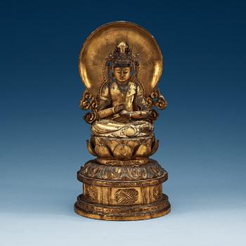 A Japanese gilt wooden seated figure of Buddha, 19th Century.
