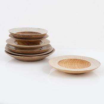 Magnus Ek, a set of seven ash wood plates for Oaxen Krog, 2020.