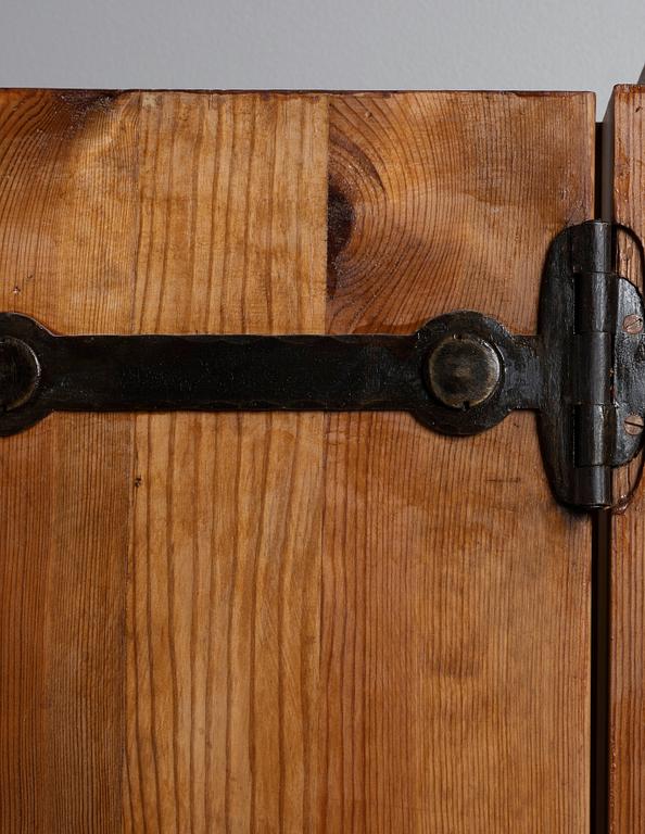 An Axel Einar Hjorth pine wall cabinet, Nordiska Kompaniet, Sweden 1930's.