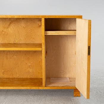 A bookcase with cabinet, 1930's.