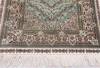 An Oriental silk rug, approx. 154 x 91 cm.