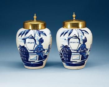 656. A pair of Dutch fainece tobacco jars, 18th Century.