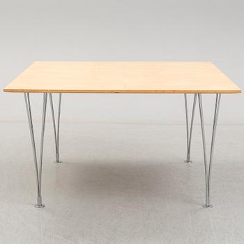 A birch veneered dining table by Bruno Mathsson and Piet Hein.