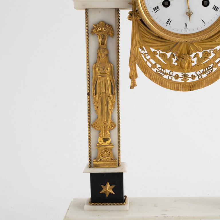 A French Louis XVI ormolu and marble portico clock, late 18th century.