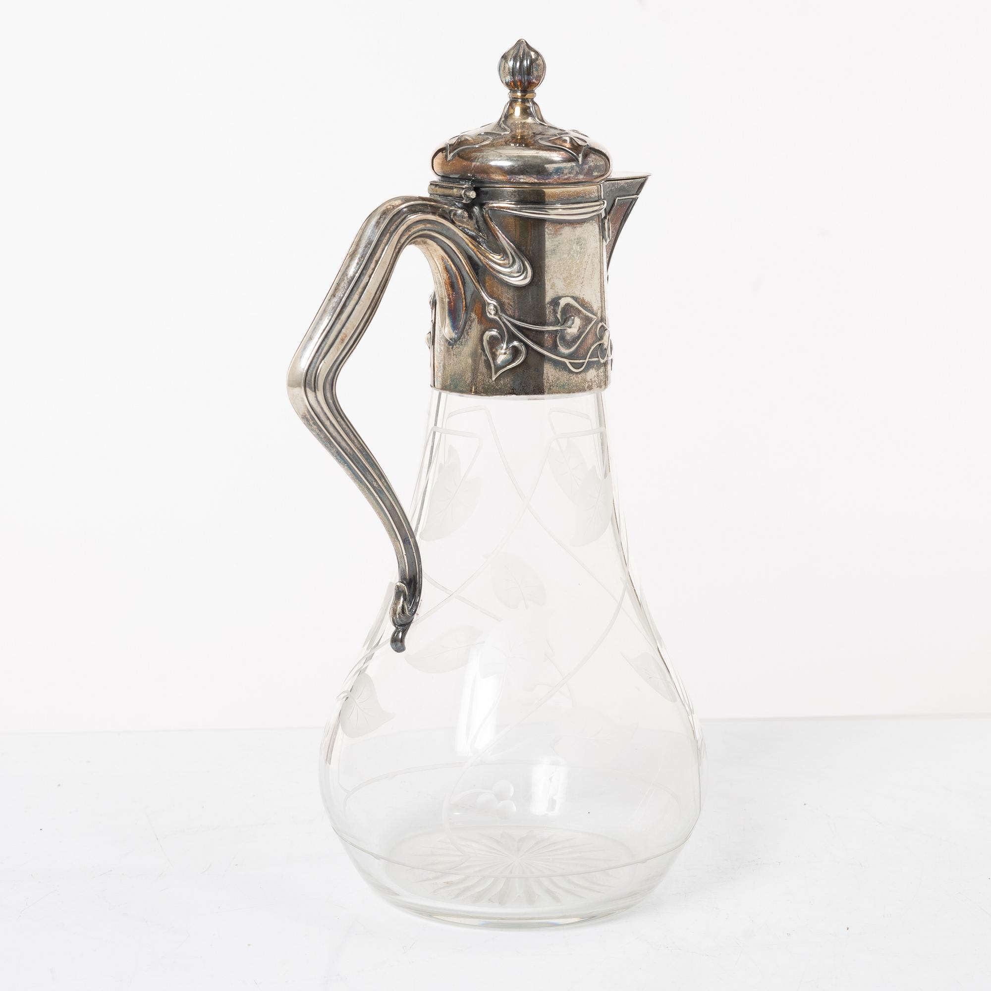 A silver and glass Art Nouveau claret jug, David Andersen, Stockholm, 1901.