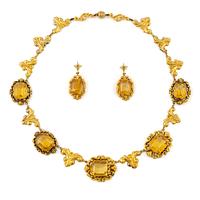 A necklace and a pair of earrings in 14K gold with faceted citrines.