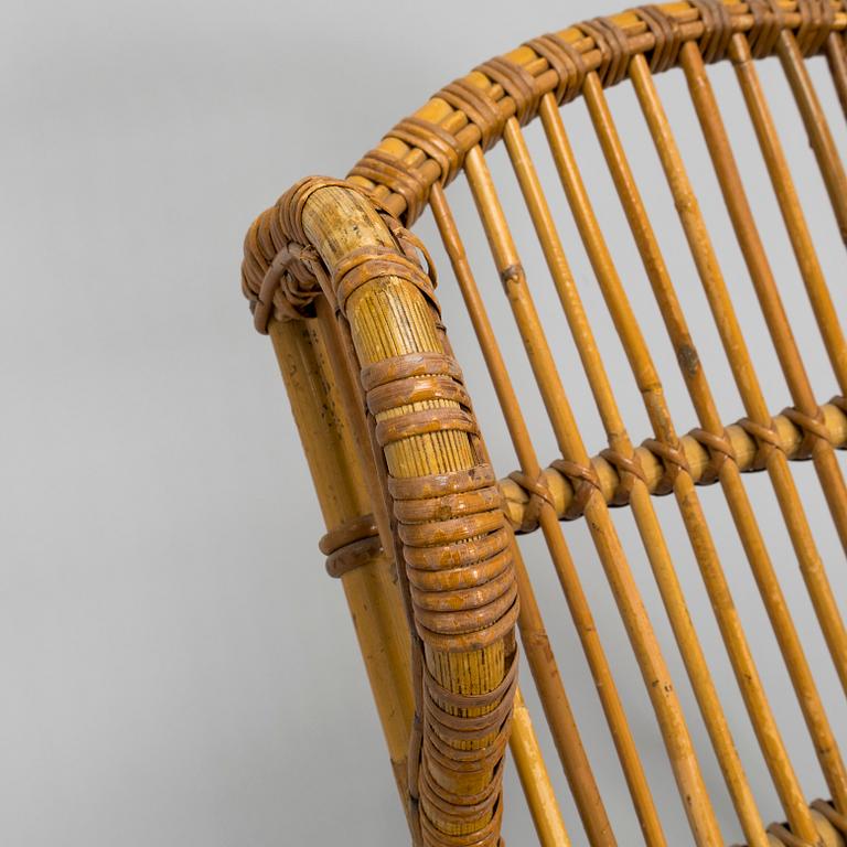 A mid-20th century rattan lounge chair.