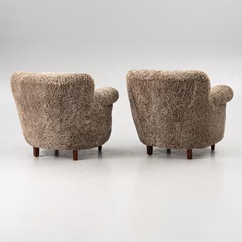 A pair of easy chairs, mid-20th century.
