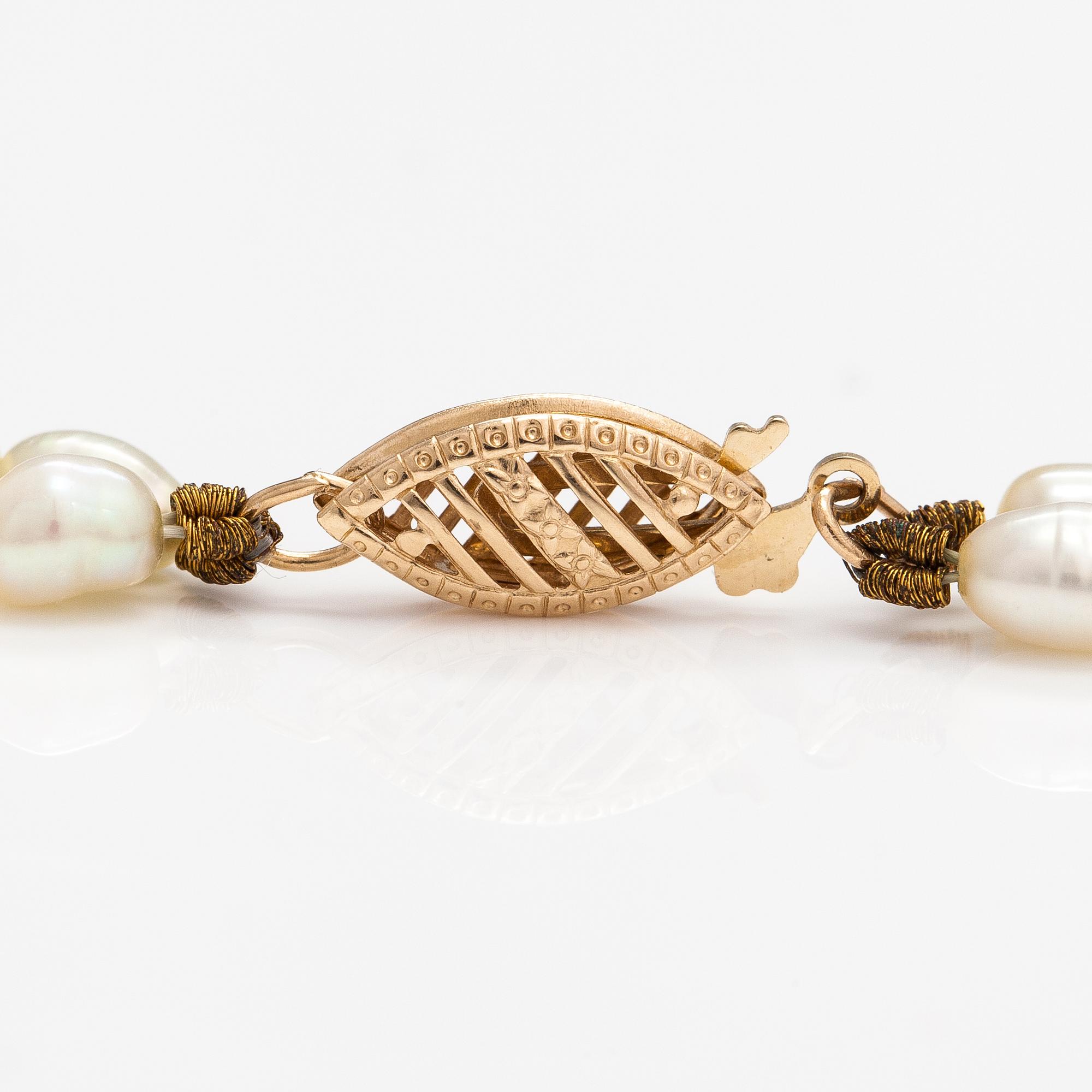 A two-strand pearl collier with cultured pearls and 14K gold clasp.