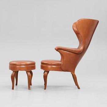 Frits Henningsen, an oak highback chair and ottoman, Denmark 1940's.